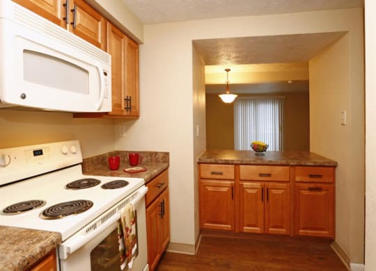 a kitchen with a stove at Monroeville Apartments, Pennslyvania, 15146