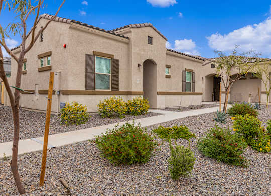 a house with a courtyard in front of it