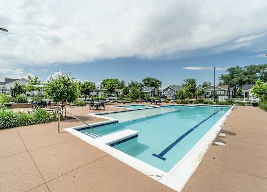 the swimming pool at the estates apartments