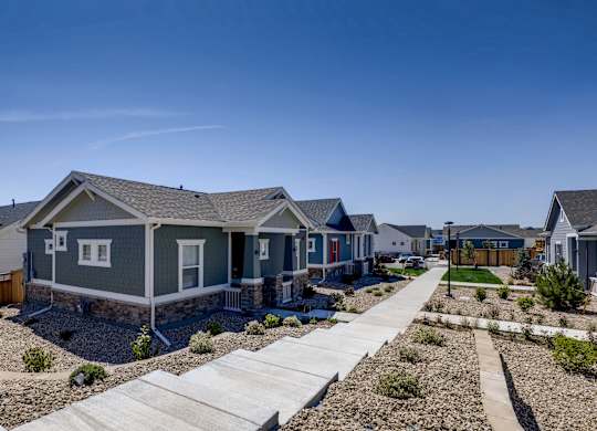 a row of houses on the side of a street