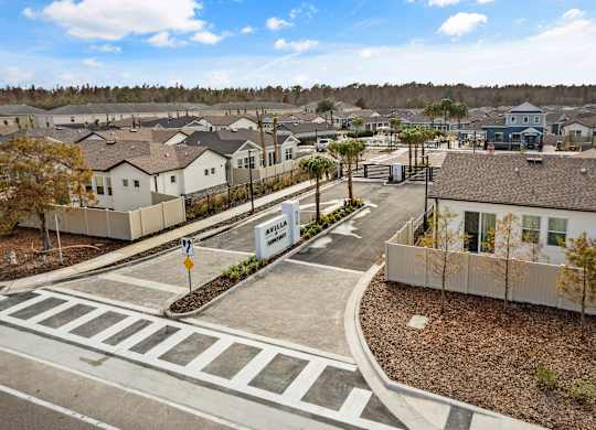 an aerial view of a neighborhood with houses and streets