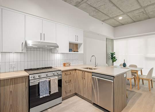 A modern kitchen with stainless steel appliances.