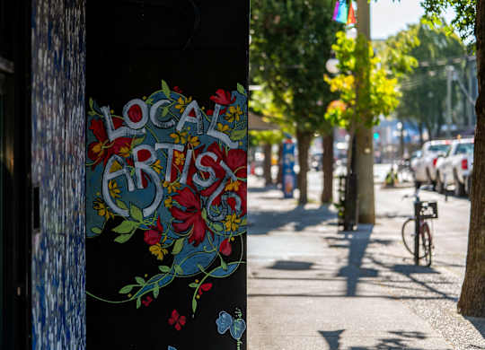 Art that says “Local Artist” is on a wall.