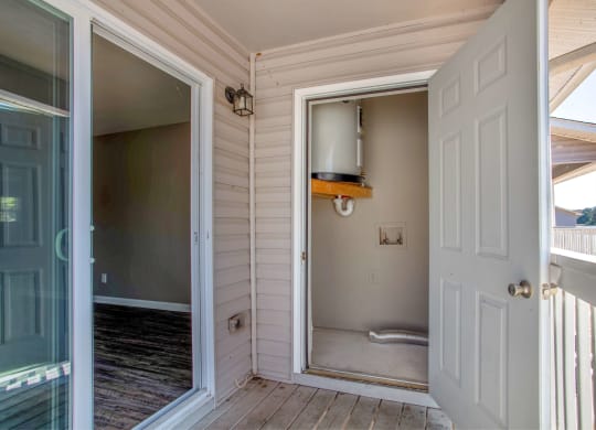a view of a bathroom from a porch with a door