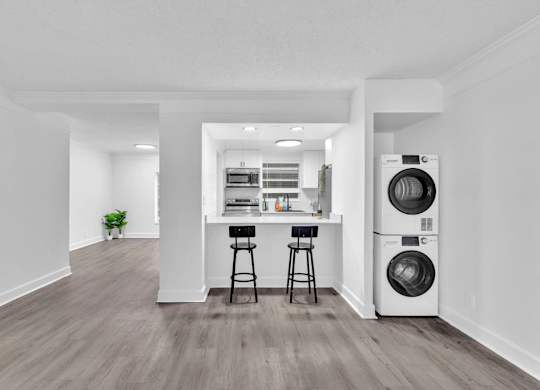 A laundry room with a washer and dryer.