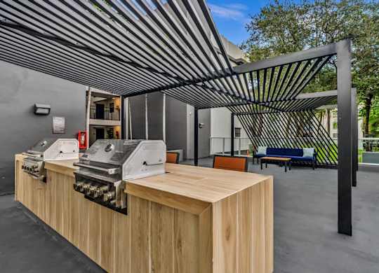 A large wooden table with a metal roof structure above it.