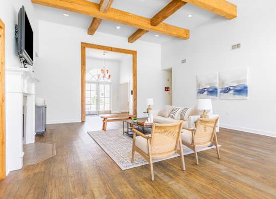 A living room with wooden floors and furniture.