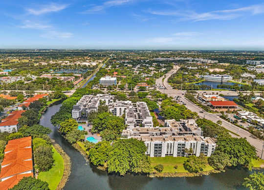 A river flows through a city with apartment buildings on either side.