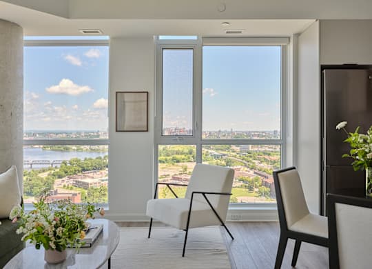 A living room with a view of the cityscape.