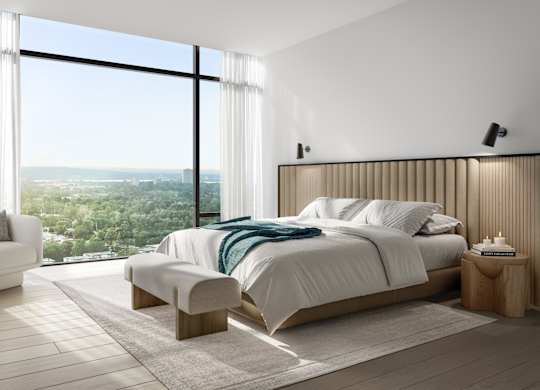 A modern bedroom with a large bed and a view of the city.