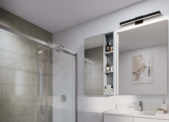 A modern bathroom with a toilet, sink, and shower.