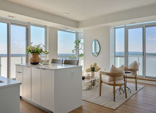 A modern kitchen with a view of the ocean.