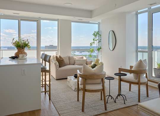 A living room with a view of the city.