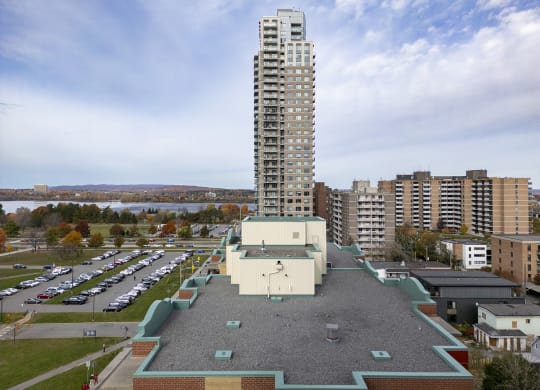 a tall building sitting on top of a roof in a city
