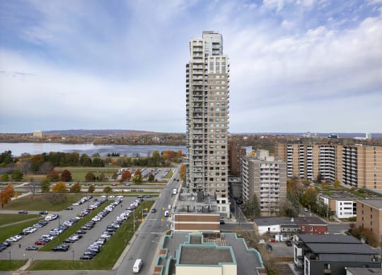 an aerial view of a tall building in a city