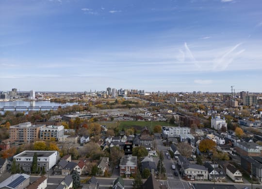 an aerial view of a city with a river and a city skyline