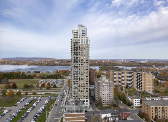 an aerial view of a tall building in a city