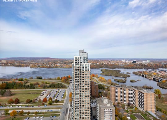 an aerial view of a city with tall buildings and a river