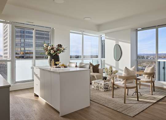 A modern kitchen with a view of the city.