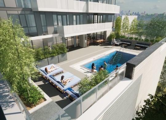 an aerial view of an apartment building with a pool and terraces