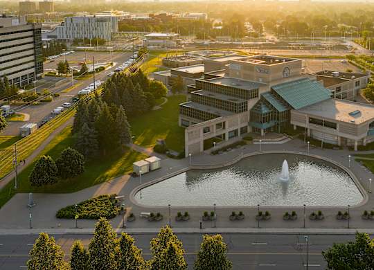 A large building with a fountain in front of it.