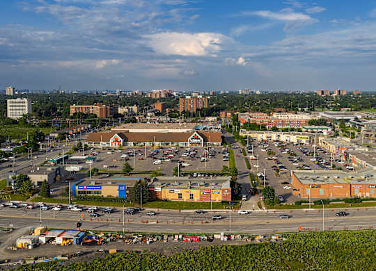 A view of a parking lot and buildings from a high vantage point.