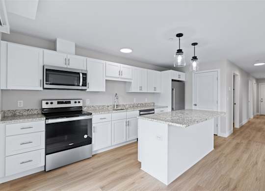Bright, Modern Kitchens with White Cabinets, Stainless Steel Appliances, and a Granite Island Perfect for Gathering