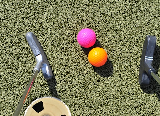 Mini golf putting green with colorful balls at Windham Village Apartments, Windham, ME 04062