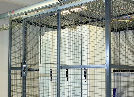 Secure storage cages with wire mesh panels at Windham Village Apartments, Windham, Maine