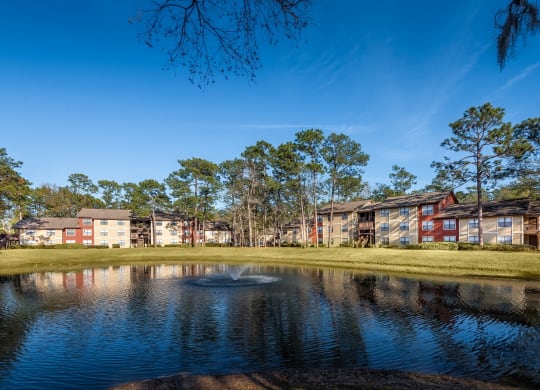 Lake view with exterior building at Northlake Apartments, Jacksonville FL