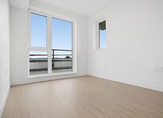 A room with a window and a door.