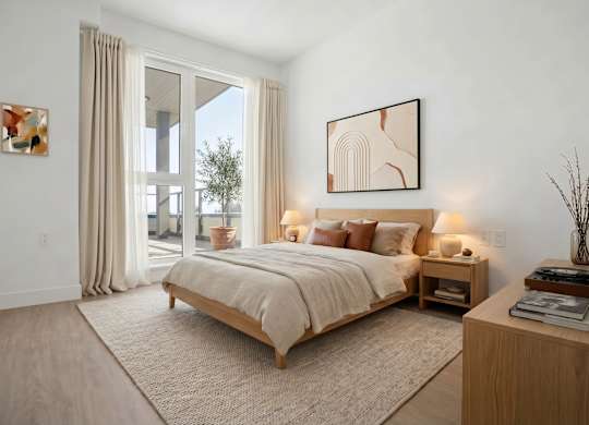 A bedroom with a large bed and a painting on the wall.