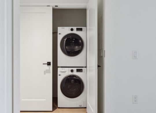 a front loading washer and dryer in a closet