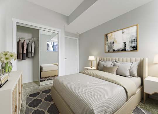 A bedroom with a large bed and a painting on the wall.