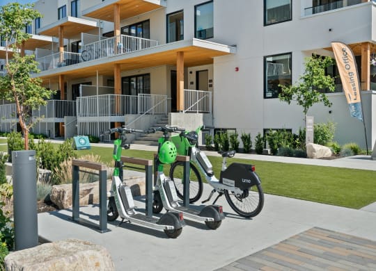 a couple of bikes parked in front of a building