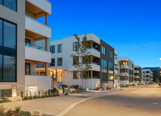 a row of modern apartment buildings on a city street