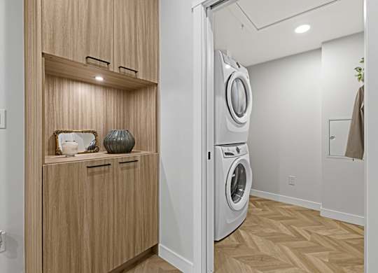 A modern laundry room with a washer and dryer.