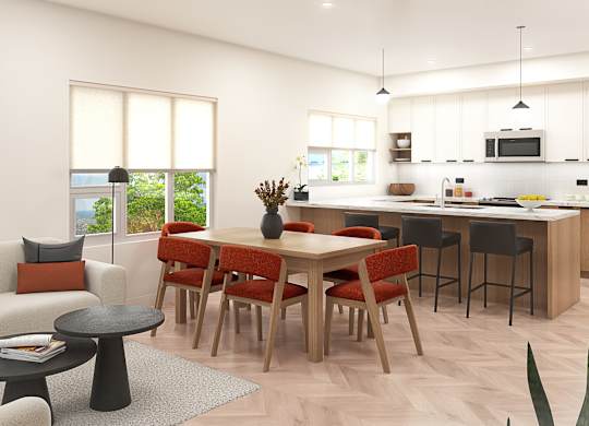 A modern kitchen with a dining table and chairs.