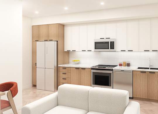 A modern kitchen with a white couch and wooden cabinets.