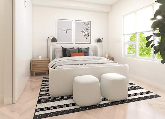 A modern bedroom with a large bed, two nightstands, and a large window.