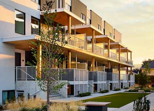 A modern apartment complex with a landscaped courtyard.