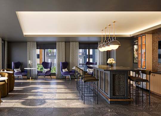 A modern living room with a bar area and comfortable seating.
