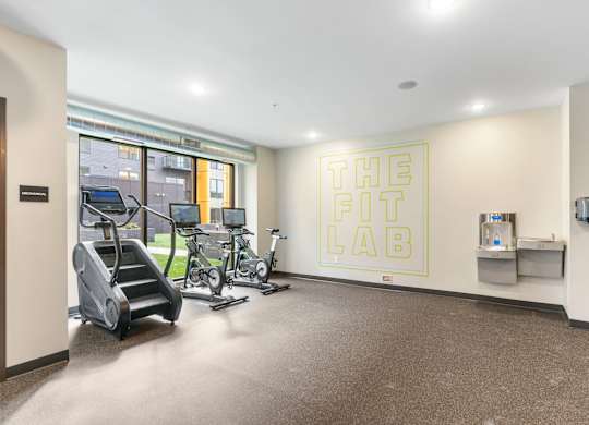 A gym room with a sign that says