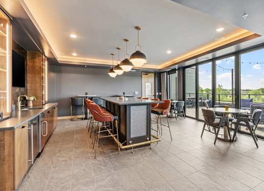 A modern kitchen with a dining table and chairs.