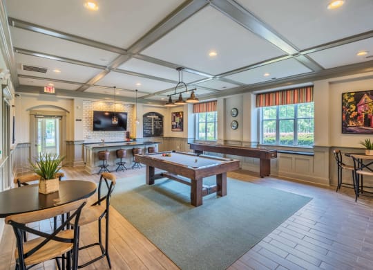 Clubhouse lounge game room with billiards and shuffleboard