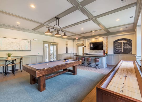 Clubhouse lounge game room with billiards and shuffleboard