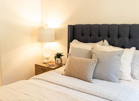 Four Seasons Logan Apartments and Townhomes Bed with Fluffy Comforter