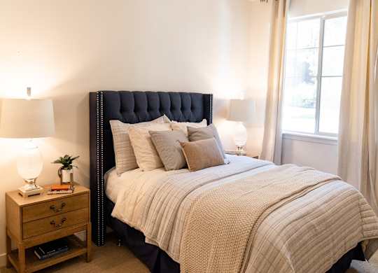 Four Seasons Logan Apartments and Townhomes Bedroom with Natural Light