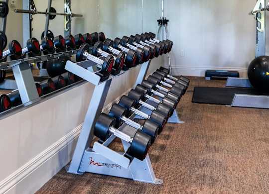 Four Seasons Logan Apartments and Townhomes Free Weights in Fitness Center