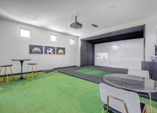 A room with a green carpet and a glass table.